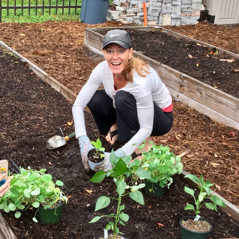 The Yoga Sanctuary owner, Jennifer French, working in the Punta Gorda Community Garden