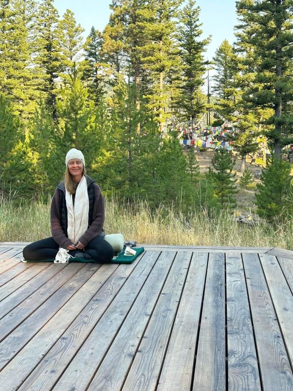 Jennifer French, E-RYT and owner of The Yoga Sanctuary enjoying the cool mountain air at Feathered Pipe Ranch