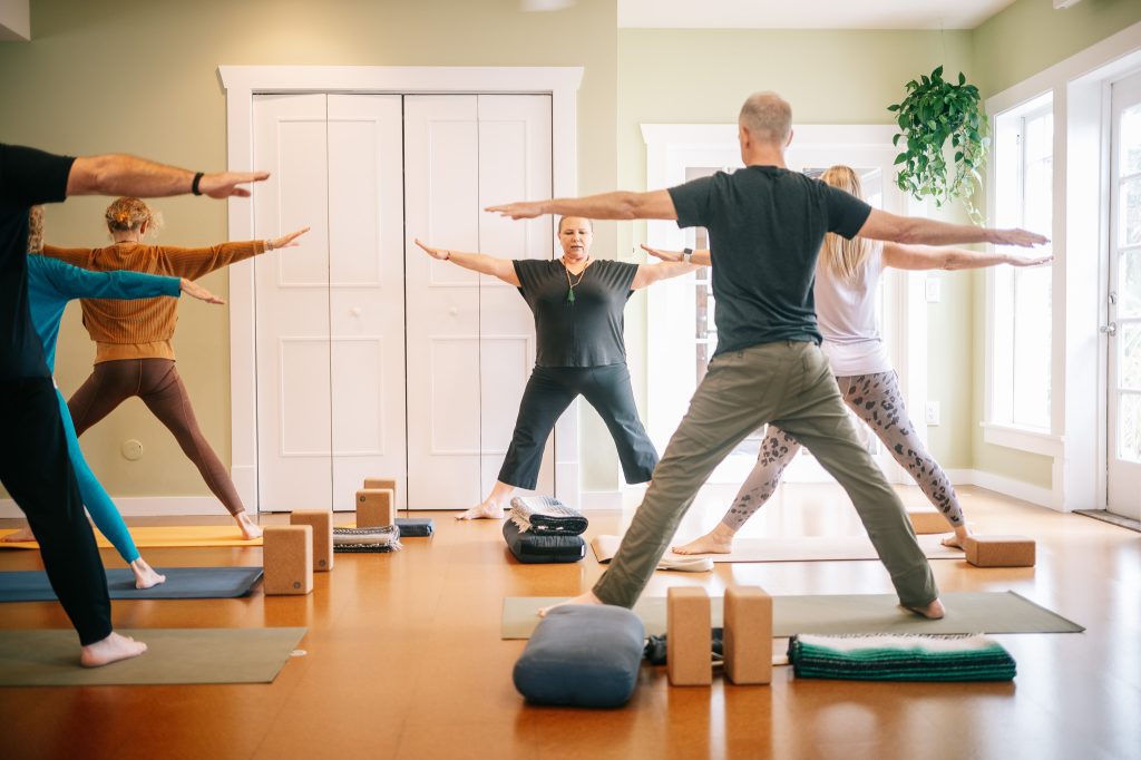 Anna Martin, senior teacher at The Yoga Sanctuary in Downtown Punta Gorda, Florida leading a yoga class.